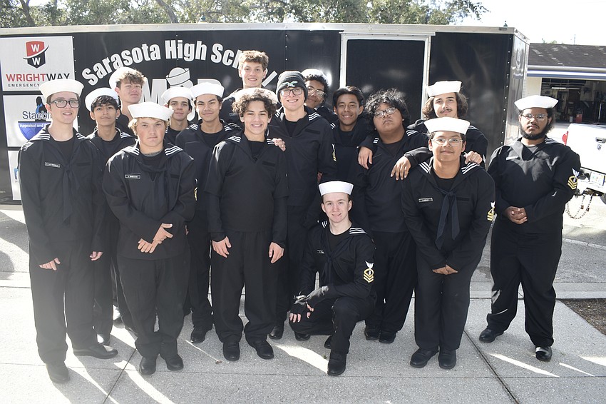 The drum line of Sarasota High School's marching band gathers together.
