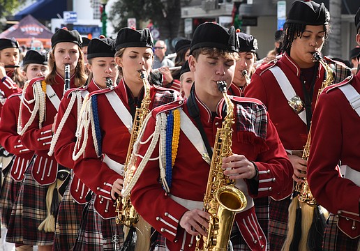 Students from the Riverview High School Kiltie Band march along the parade route.