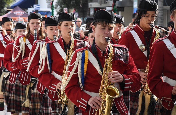 Students from the Riverview High School Kiltie Band march along the parade route.