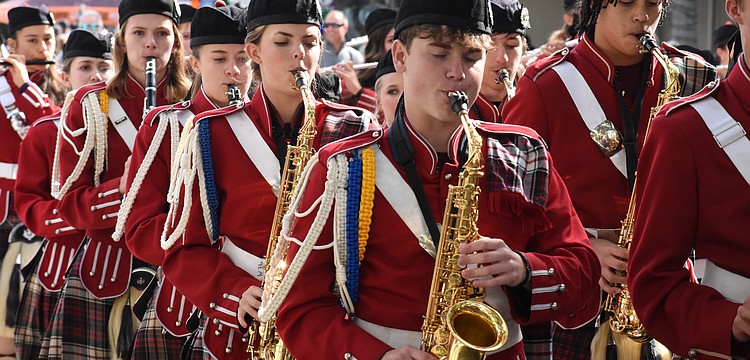 Students from the Riverview High School Kiltie Band march along the parade route.