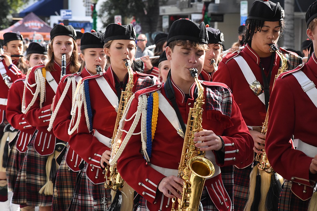 Students from the Riverview High School Kiltie Band march along the parade route.