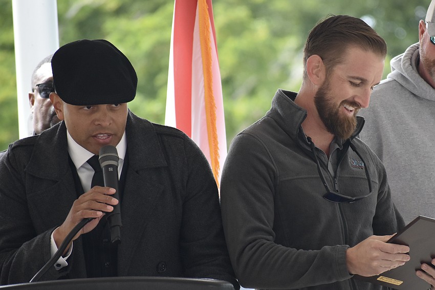 Carlos Moreira presents Matt Fonville, owner of Fonz Heating & Air in Bradenton, with the Veteran Supporter of the Year award.