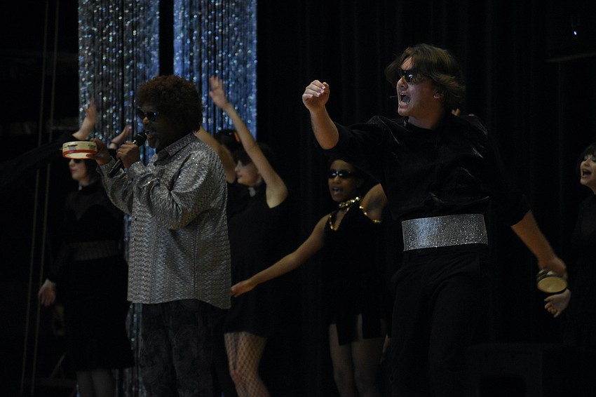 Instructor William Coleman, and senior Colten Zwizinski perform 