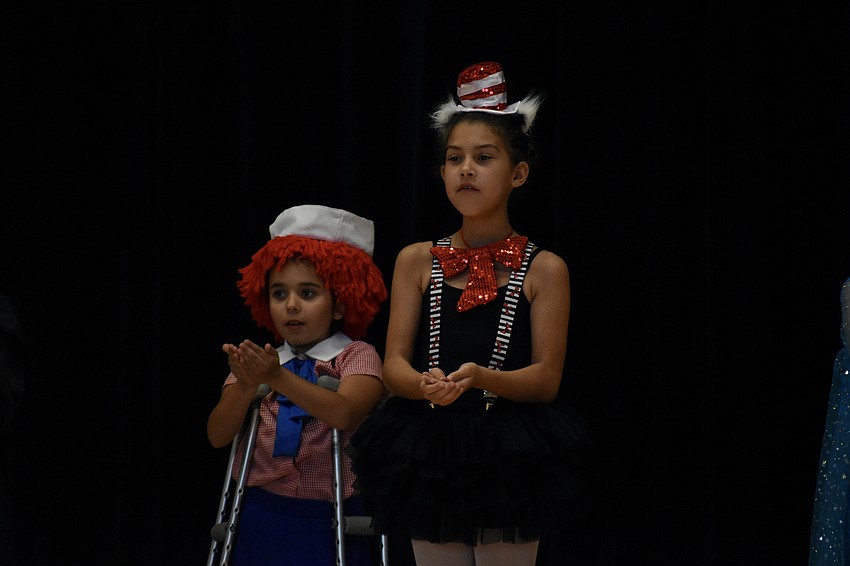 Landry Murphy, 8, and Katie Guirguis, 9, perform in 