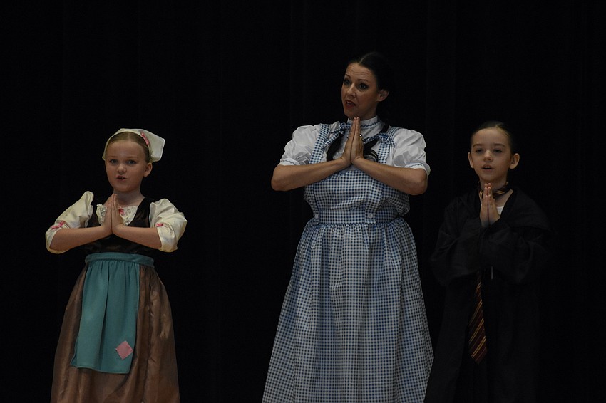 Finnley Adamson, 9, Tree Fort Productions' founder and artistic director Katherine Michelle Tanner, and Ayla Duenes, 8 perform 
