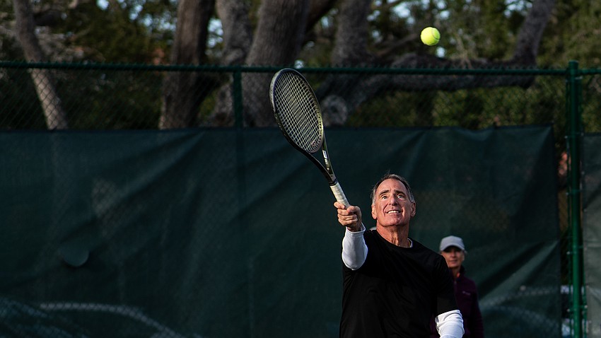 Dobs Dibbins hits an overhead during a tennis clinic demonstration during a welcome back event at the Longboat Key Tennis Center Tuesday, Nov. 11.