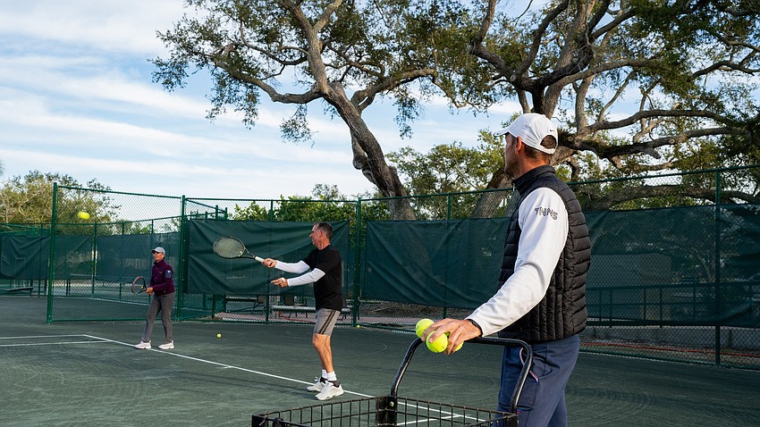 Jackie and Dobs Gibbins participate in a tennis clinic demonstration during a welcome back event at the Longboat Key Tennis Center Tuesday, Nov. 11.