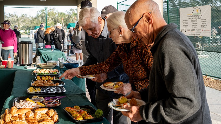 John Bradbury, Fran Ferguson and Andrew Geller (left to right) enjoy the hors d'oeuvres at the welcome back event held at the Longboat Key Tennis Center Tuesday, Nov. 11.