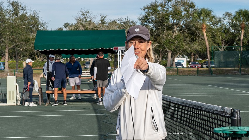 Longboat Key Tennis Center Manager Kay Thayer addresses attendees who braved the (for Florida) cold at the welcome back event at the Longboat Key Tennis Center Tuesday, Nov. 11.