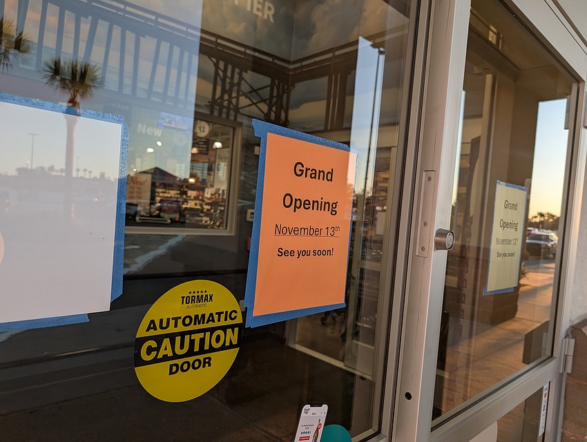 A sign on the door at the River City Marketplace Total Wine & More announces the Nov. 13 opening.