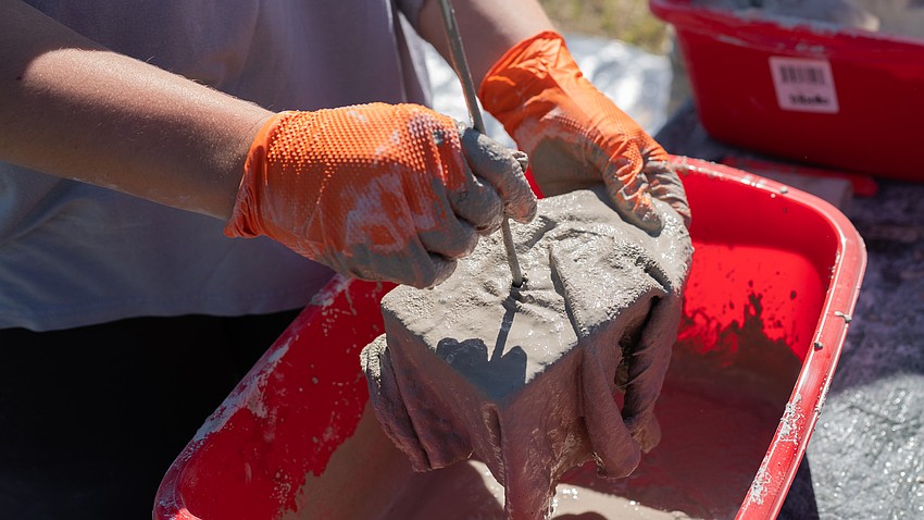 Oyster River Ecology ecological restoration technician Abbey Kuhn makes an oyster rag pot at the Rotary Club of Longboat Key’s Food for Gratitude event Nov. 12 where all town employees received free lunch to recognize their hard work after dual hurricanes in 2024.