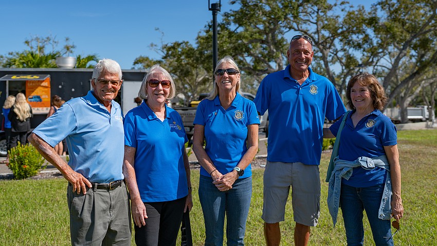 From left to right: Jim Chirgwin, Carol Erker, Terry Driver, Jeff Driver and Belinda Bauer pose for a photo at Rotary Club of Longboat Key’s Nov. 12 Food for Gratitude event where all town employees received free lunch to recognize their hard work after dual hurricanes in 2024.