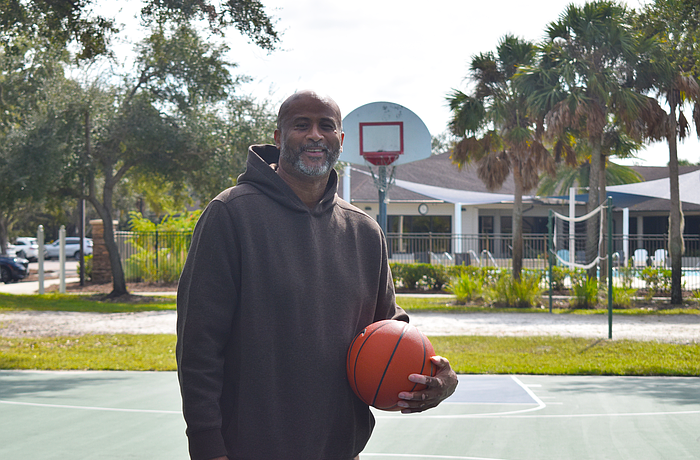 Marcus Liberty poses for a photo on Nov. 10 at Edgewater Park in Lakewood Ranch. He featured as a forward for the King College Prep boys' basketball team which won the Illinois High School Association’s 1985-86 Class AA state championship.