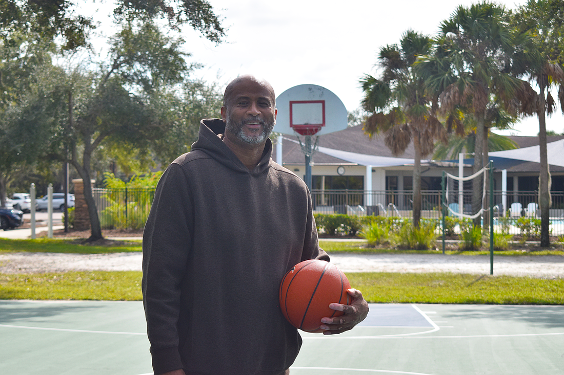Marcus Liberty poses for a photo on Nov. 10 at Edgewater Park in Lakewood Ranch. He featured as a forward for the King College Prep boys' basketball team which won the Illinois High School Association’s 1985-86 Class AA state championship.