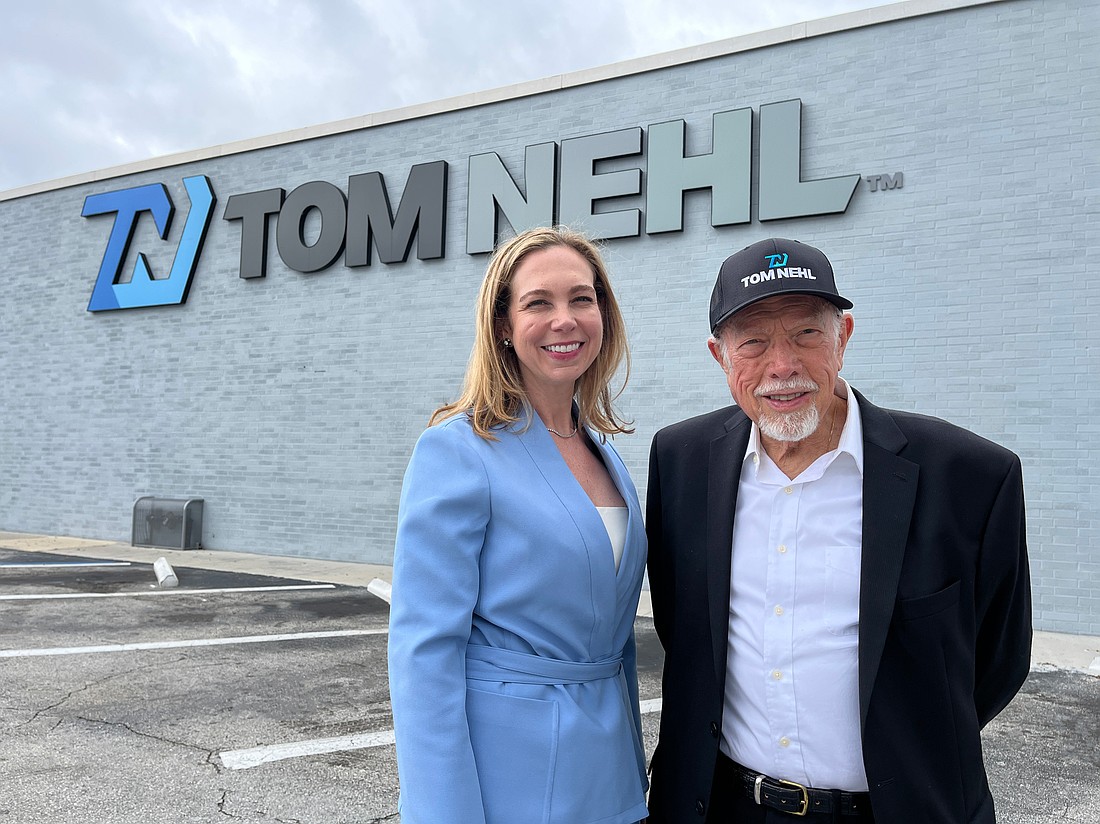 Lauren Scheible, Tom Nehl Truck Co. executive vice president and co-dealer principal, and Steve Bacalis, Tom Nehl owner.