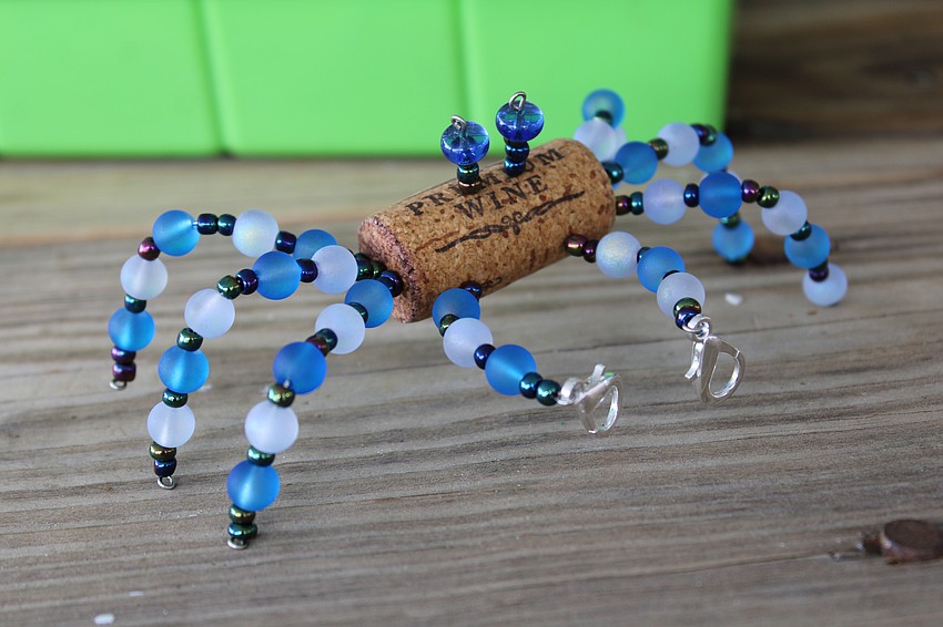 Madison Ditmars said the crab figures she crafts are a unique, handmade keepsake fans of the Sarasota Ski-A-Rees can pick up at their shows.