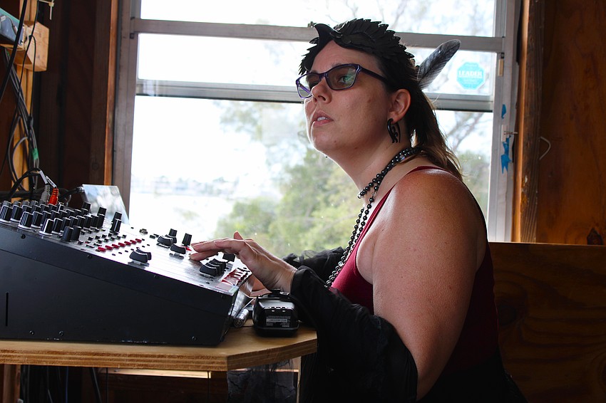 Sarasota Ski-A-Rees sound technician Madison Ditmars keeps a close eye on the performers from up in the sound booth overlooking Sarasota Bay.