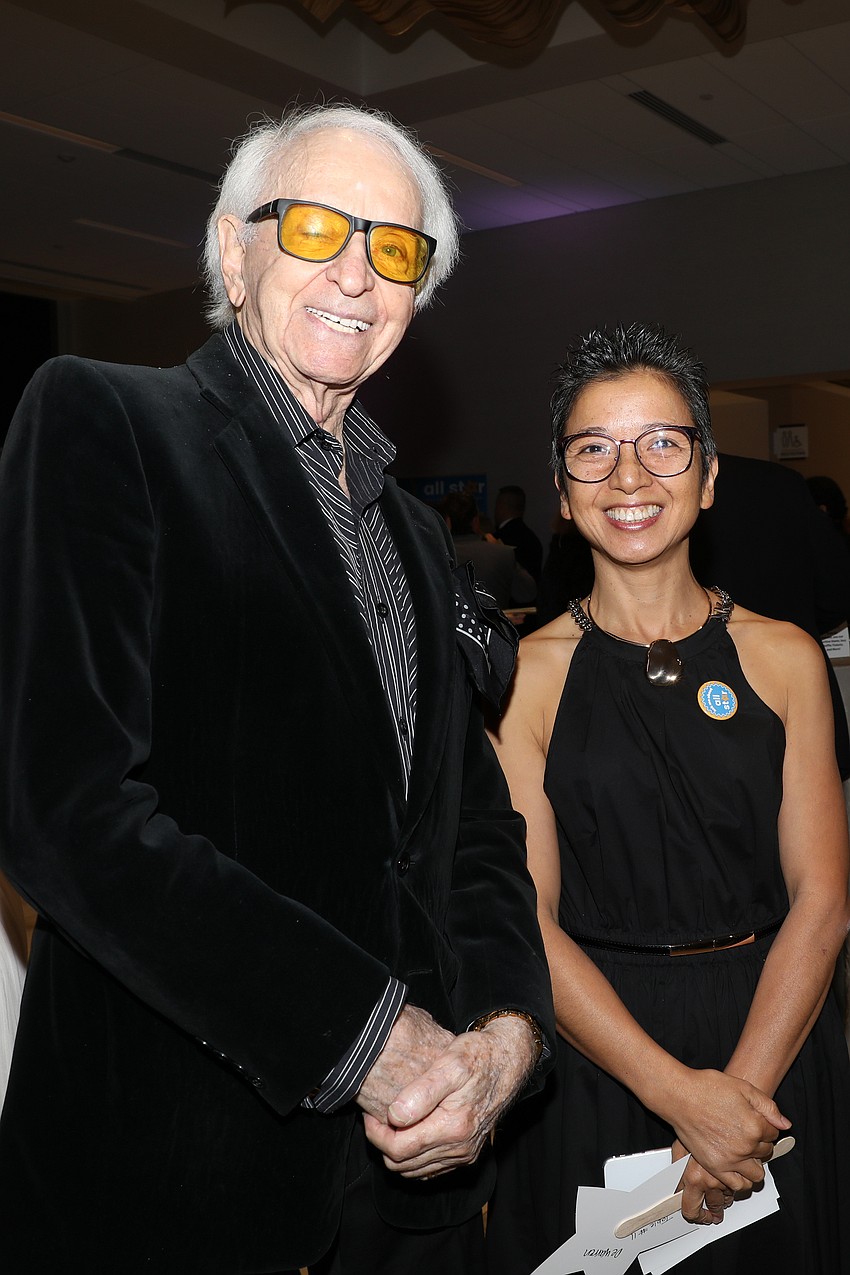 Robert De Warren and Yan Lu don the biggest smiles.