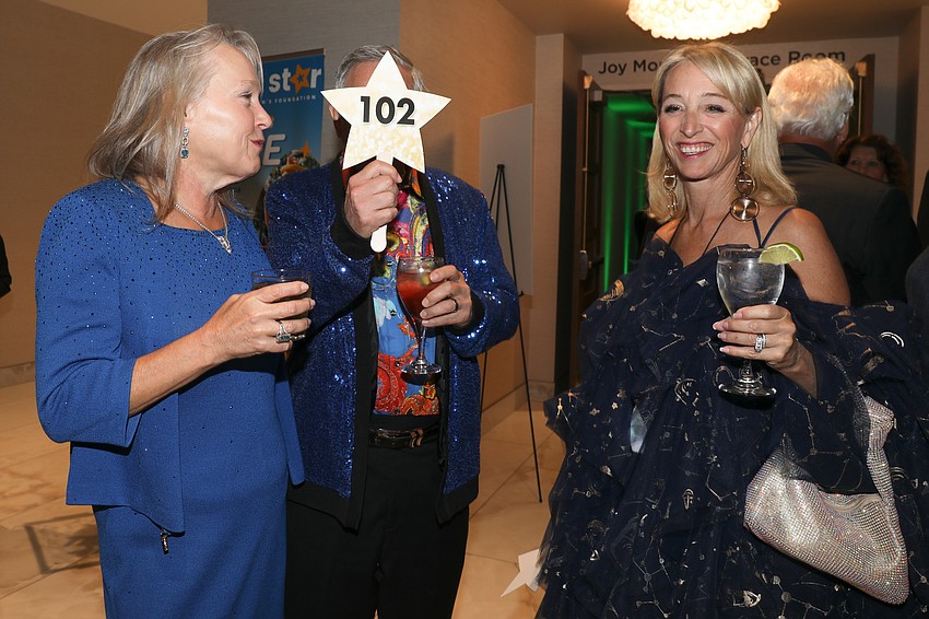 Michelle Mitchell, bid card#102 and Sharon Stevenson.