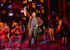 Aaron Kaburick brandishes a fish in Asolo Repertory Theatre's production of "Come From Away."