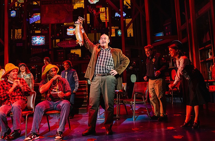Aaron Kaburick brandishes a fish in Asolo Repertory Theatre's production of "Come From Away."