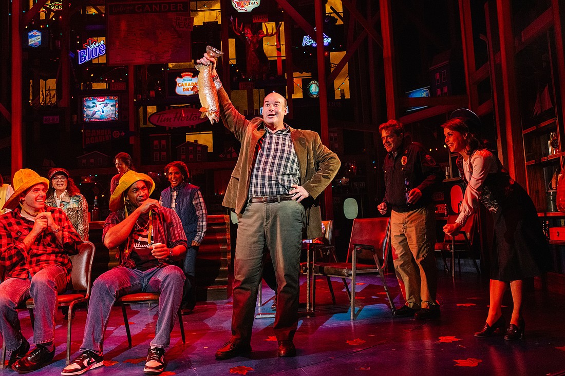 Aaron Kaburick brandishes a fish in Asolo Repertory Theatre's production of "Come From Away."