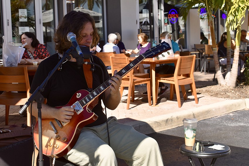 One man band Zack Pomerleau entertains the crowd.
