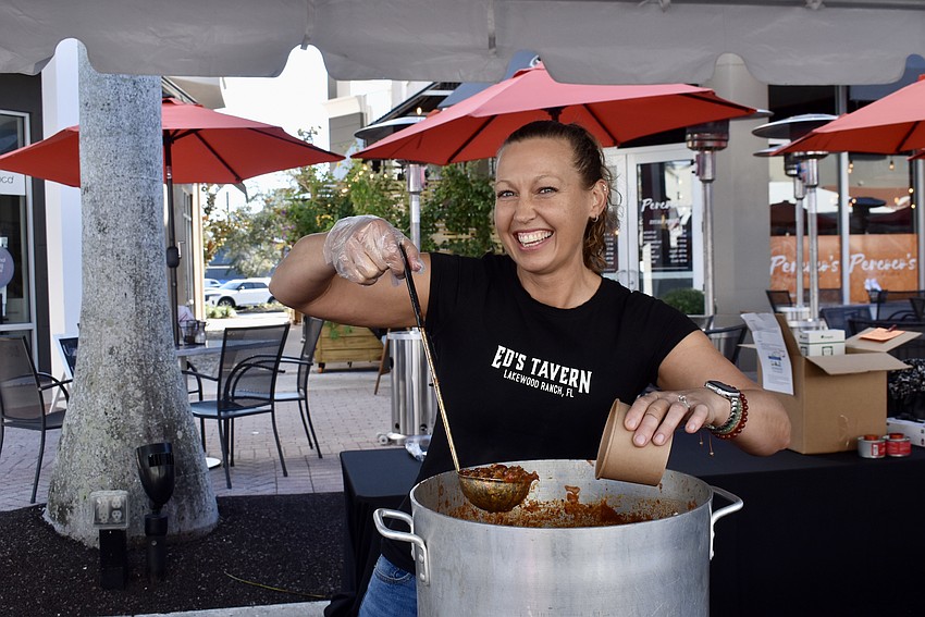 Ali Pereira dishes up chili for Ed's Tavern.