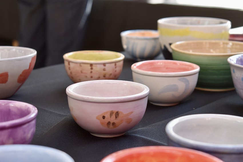 Local artists donate the bowls that are given away to guests.