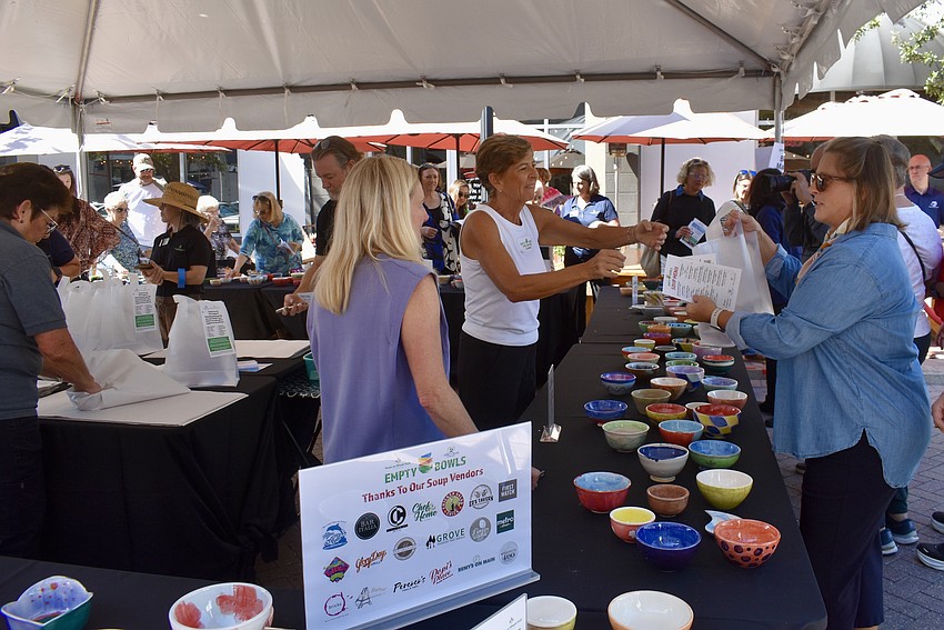 Guests peruse the array of handmade bowls.