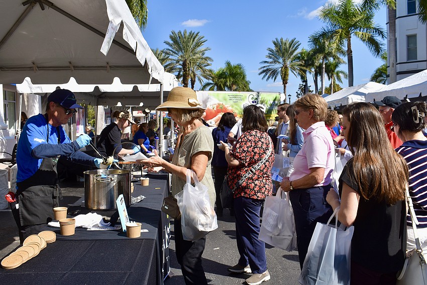 The Station 400 tent has guests lining up for a taste of the broccoli and cheddar soup.