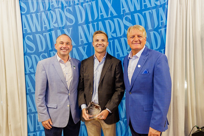 Downtown Vision Inc. CEO Jake Gordon, Downtowner of the Year Bryan Moll, principal of Gateway Jax, and DVI board chair Paul Davison at the 1th annual DTJax Awards. Downtown Vision Inc. CEO Jake Gordon, Downtowner of the Year Bryan Moll, principal of Gateway Jax, and DVI board chair Paul Davison at the 1th annual DTJax Awards.