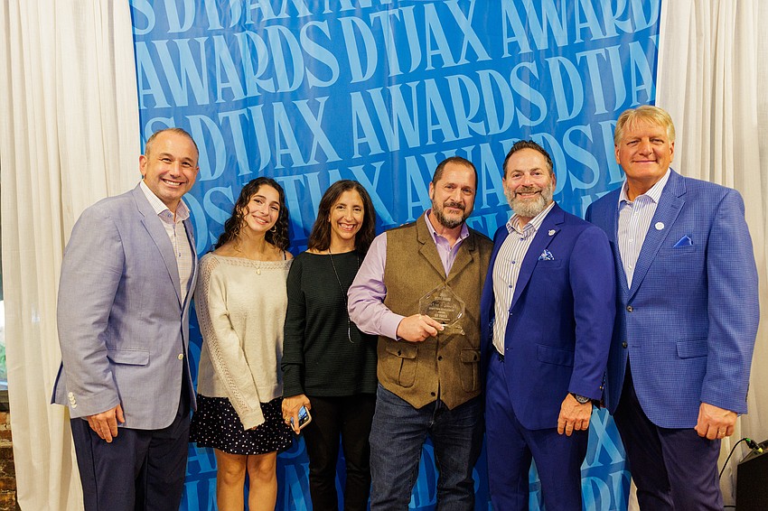 Downtown Achievement Award winner Guy Parola, director of operations for the Downtown Investment Authority, holds his award at the 11th annual DTJax Awards at The Lark in Downtown Jacksonville. Downtown Achievement Award winner Guy Parola, director of operations for the Downtown Investment Authority, holds his award at the 11th annual DTJax Awards at The Lark in Downtown Jacksonville.