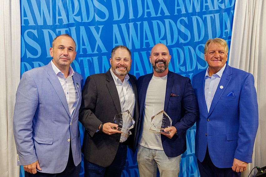 Pour Taproom and Pizza Dynamo in the VyStar Credit Union garage at 61 N. Laura St was named the Retail Project of the Year at the 11th annual DTJax Awards. From left, Downtown Vision Inc. CEO Jake Gordon, Pour Taproom owner Tony Draper, Pizza Dynamo owner Jeremy Gatto and DVI board chair Paul Davison. Pour Taproom and Pizza Dynamo in the VyStar Credit Union garage at 61 N. Laura St was named the Retail Project of the Year at the 11th annual DTJax Awards. From left, Downtown Vision Inc. CEO Jake Gordon, Pour Taproom owner Tony Draper, Pizza Dynamo owner Jeremy Gatto and DVI board chair Paul Davison.