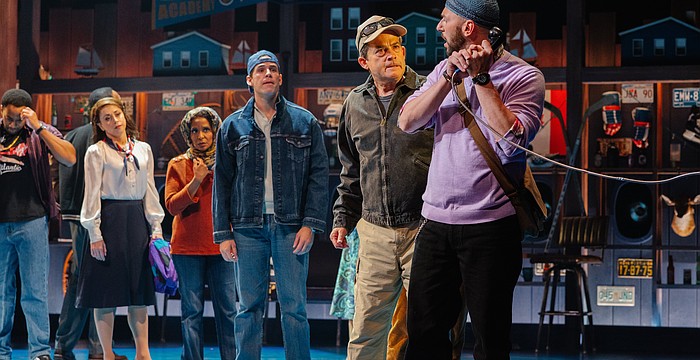 Anxious travelers are desperate to contact loved ones after they are stranded in Gander, Newfoundland, in Asolo Rep's production of "Come From Away."