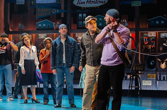 Anxious travelers are desperate to contact loved ones after they are stranded in Gander, Newfoundland, in Asolo Rep's production of "Come From Away."