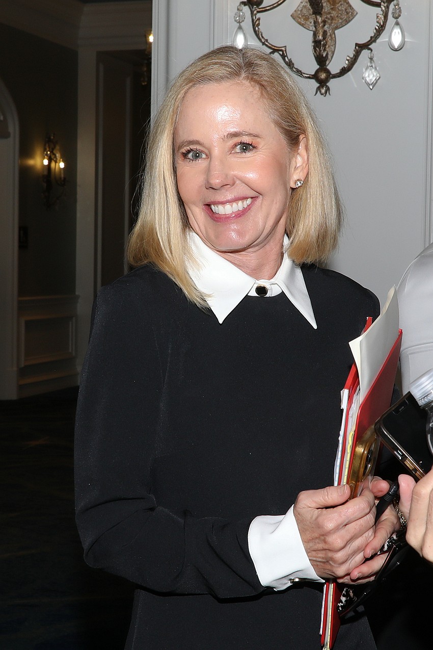 Mid-ship and mid-event is Minta Getzen with her continuous and confident smile.