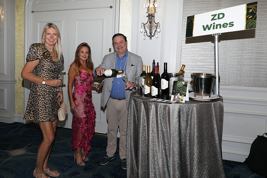 John Buckey from ZD Wines pours for Justine Schneider and Nicole Behar.