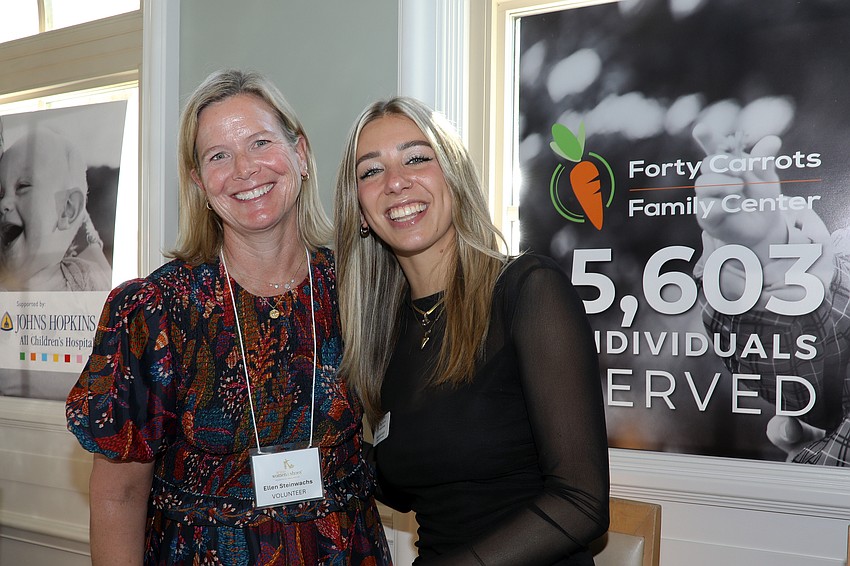 Volunteer Ellen Steinwachs and Forty Carrots Development Manager Marguerite Andrich check guests in for the 19th year of WWS.