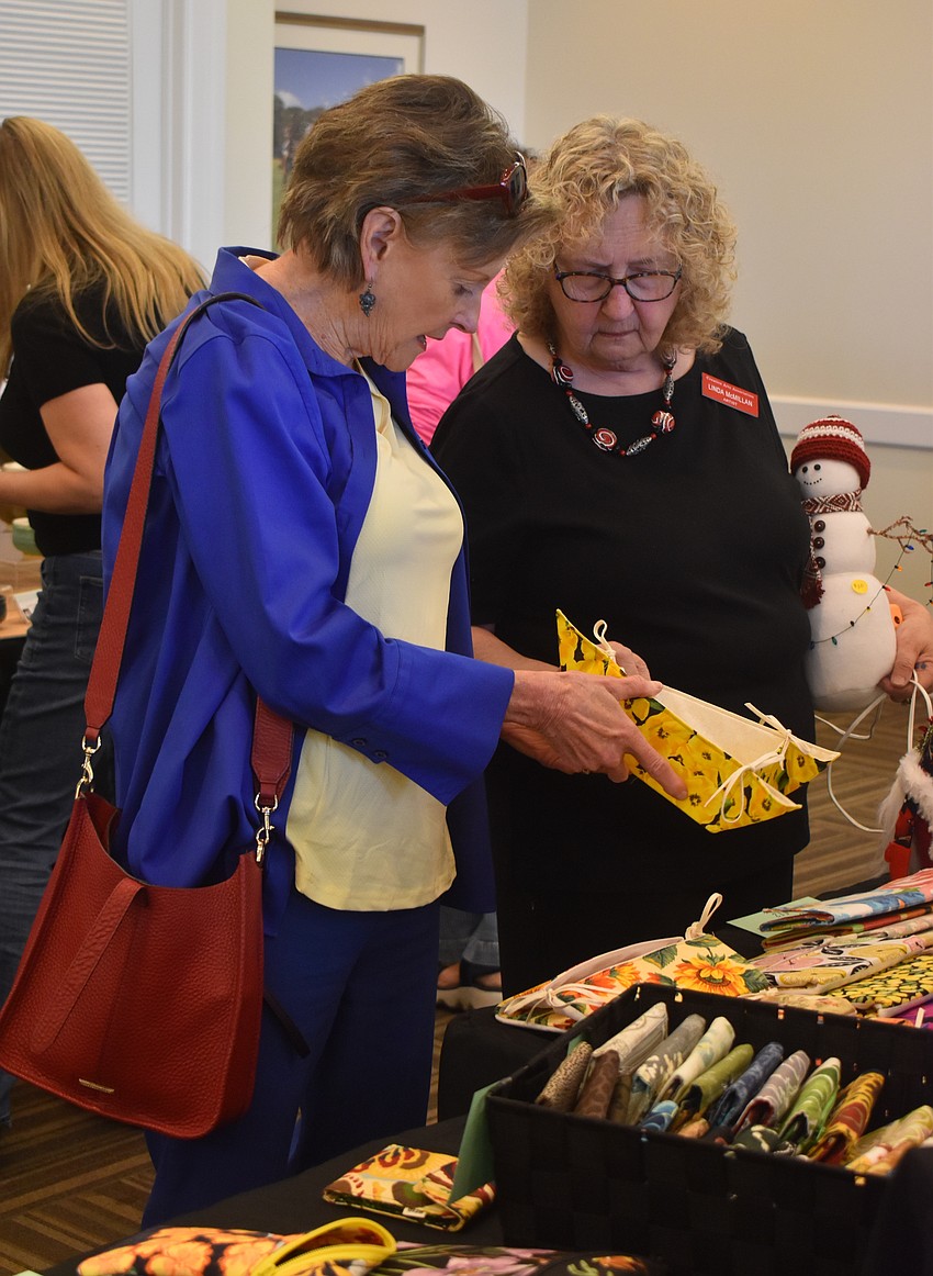 Lakewood Ranch's Pam Kean goes to the sale every year and couldn't leave without purchasing a couple of collapsible bread baskets from Linda McMillan's booth LKM Fanciful Creations.