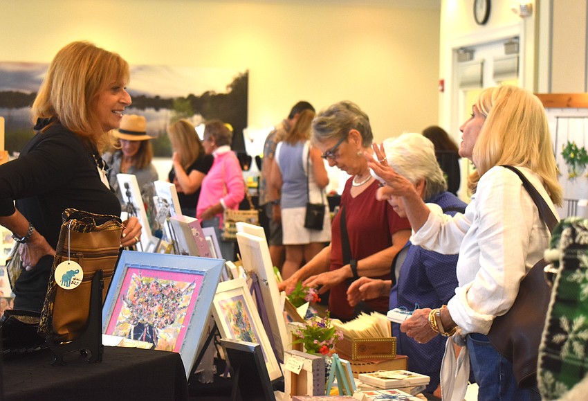 Carole Lewis, who sells mixed media art pieces, gets a visit from her good friend Pam Ellis. Ellis describes the mixed media pieces as cheerful, beautiful, creative and original.