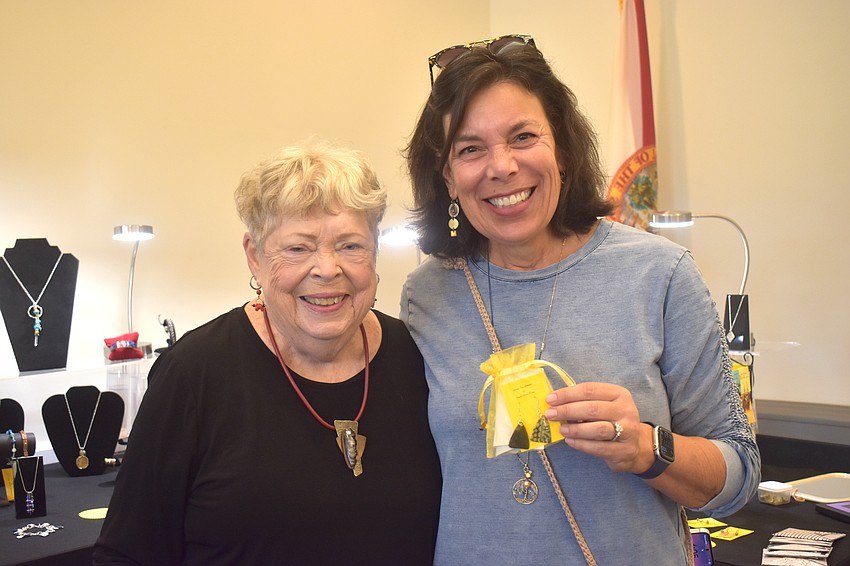 Susan Perry sells a pair of homemade earrings to Lakewood Ranch's Jo Jadin, who describes the earrings as fun and different.