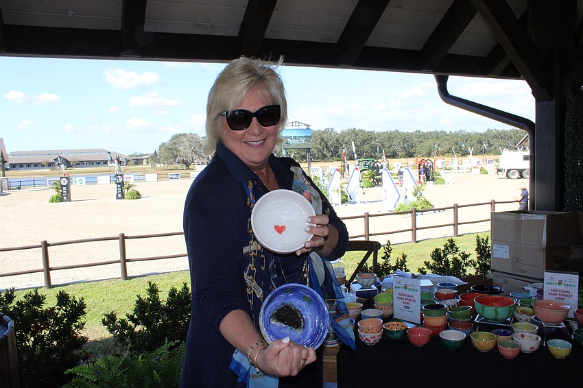 Meals on Wheels Plus of Manatee CEO and president Maribeth Phillips loves handing out specially made bowls for those participating at The Event at TerraNova Nov. 16.