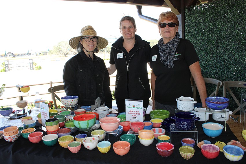 Kelly Pinskey, Amy Towery and Tricia O'Brien of Meals on Wheels Plus of Manatee get ready for the crowd at a special TerraNova Empty Bowls Sunday during The Event at TerraNova.
