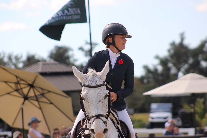 Jessica Phoenix of Canada checks the scoreboard after her run aboard Wabbit at TerraNova. She finished 11th.