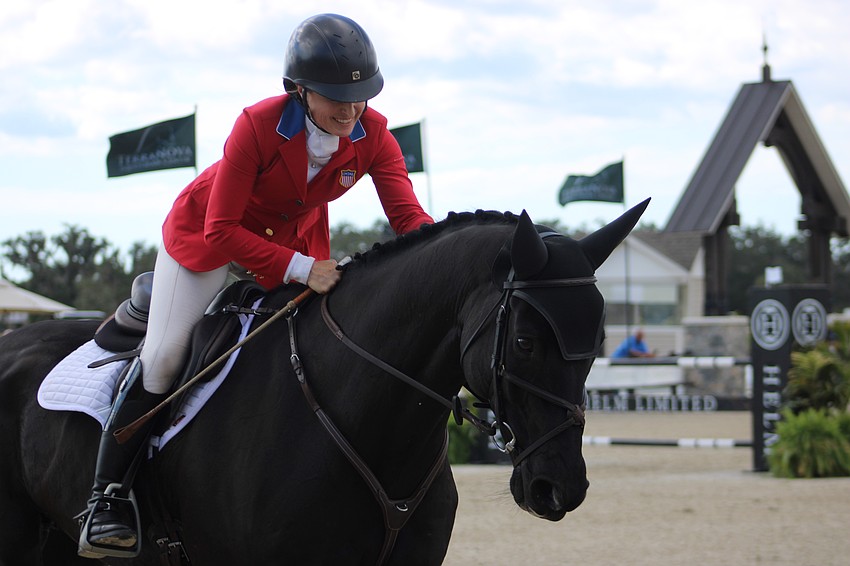 Sydney Elliott gives QC Diamantaire a tap after they completed a flawless final run to win the CCI4 The Event at TerraNova Nov. 16 in Myakka.