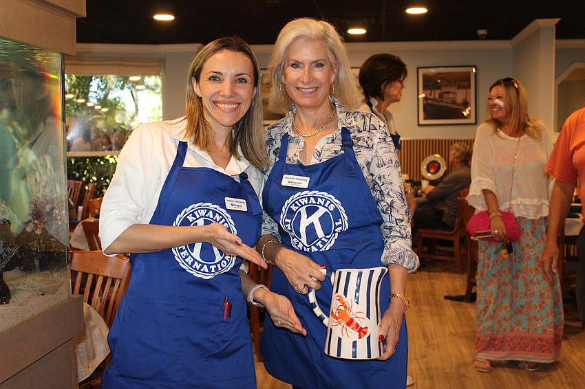 Svetlana Ivashchenko, executive director of the Children's Guardian Fund, joins Kiwanis Club of Longboat Key president Danielle Gladding in selling raffle tickets at the annual pancake breakfast fundraiser on Nov. 15 at the Lazy Lobster.