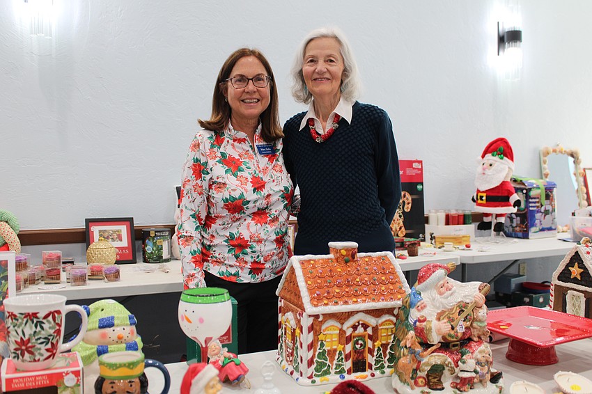 Mary Golia and Jolana Popcak volunteer to help shoppers at the Christmas bazaar at St. Mary, Star of the Sea, Catholic Church last weekend.