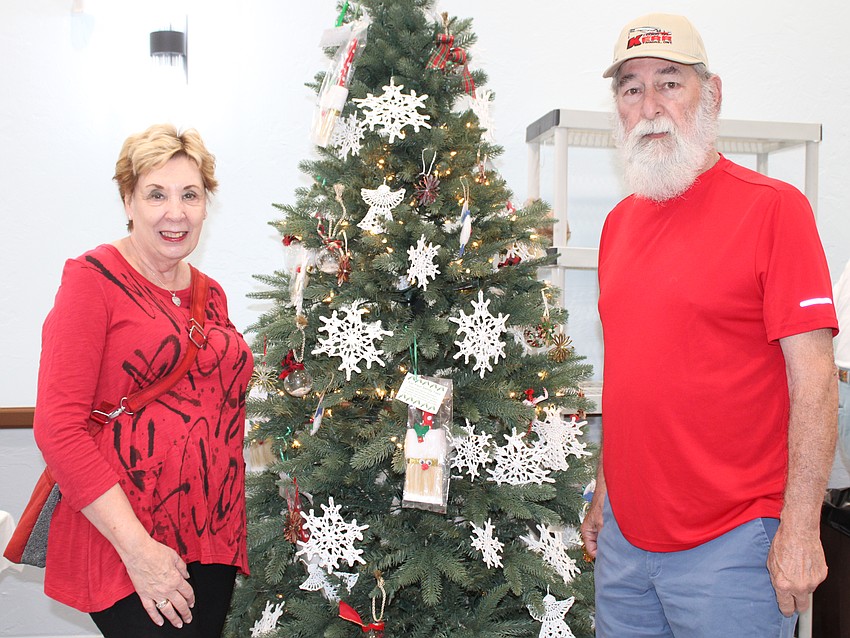Karen and Richard “Sparky” Pashkow embraced the holidays at the St. Mary, Star of the Sea, Catholic Church Christmas bazaar on Nov. 15.