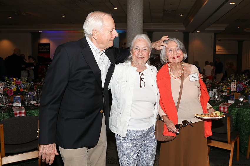 Always the gentleman Janis Hobart's husband, Skip, acts as the photographer's stylist to ensure Mary Lou Winnick looks her best!